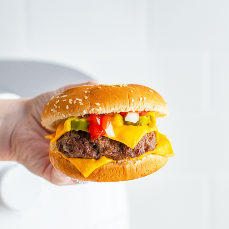 Classic McDonald&rsquo;s style hamburger with pickles ketchup and soft bun