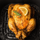 Homemade Montreal chicken seasoning blend in a small bowl with herbs and spices.