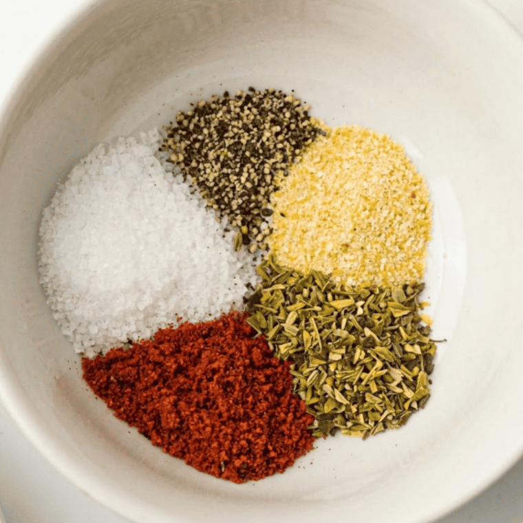 Spices for Montreal chicken seasoning measured into a small bowl
