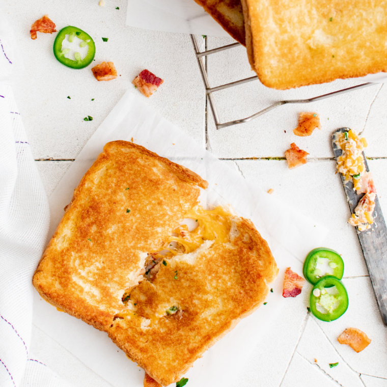 Golden toasted sandwich flipped halfway through cooking process