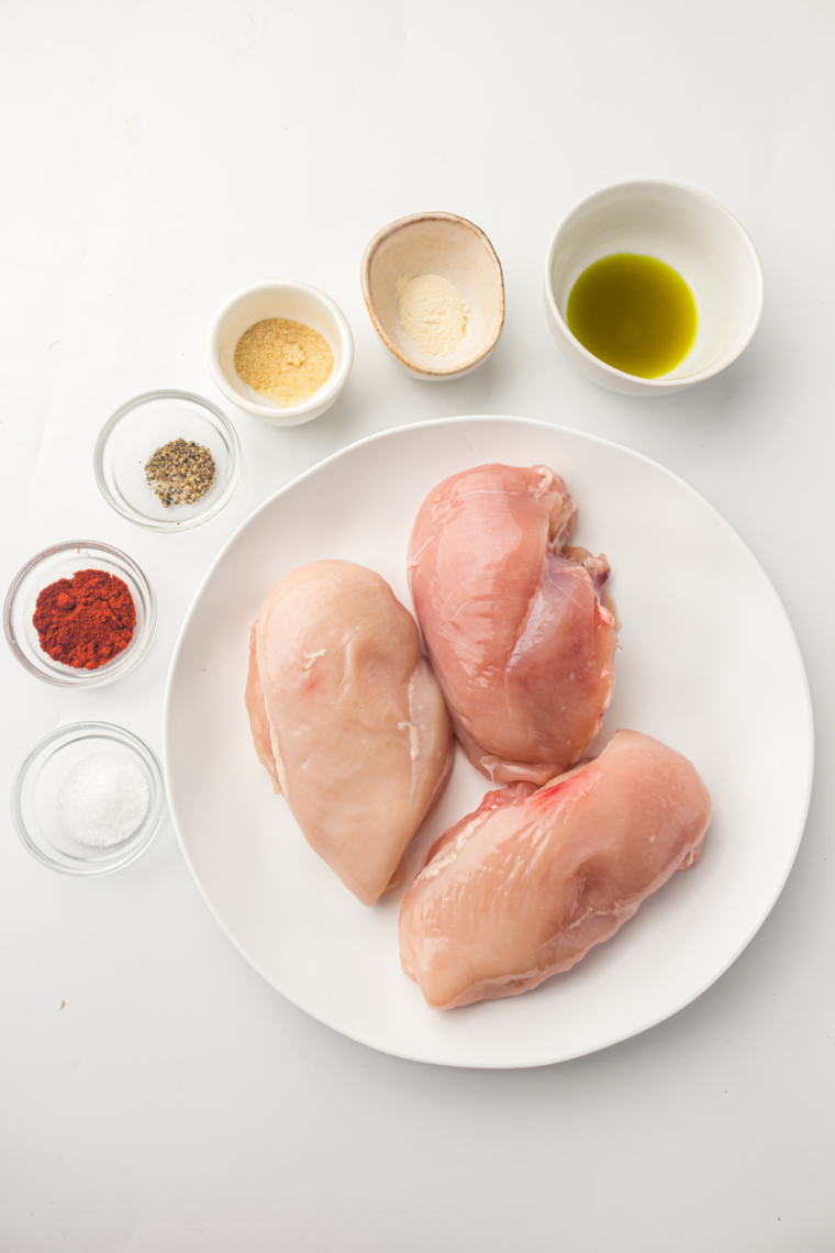 Ingredients needed for Ninja Crispi Ginger-Garlic Chicken Breasts on kitchen table.