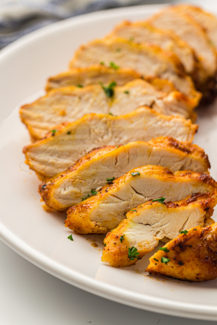 Homemade ginger-garlic chicken breasts freshly cooked in the Ninja Crispi cooker