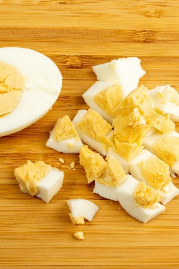 Close up of creamy yolk Ninja Crispi hard boiled eggs with seasoning