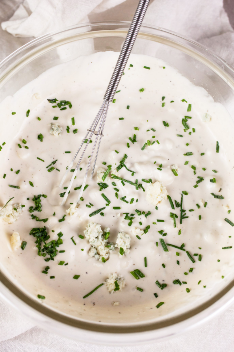 Fresh herbs and spices mixed into creamy ranch dressing base