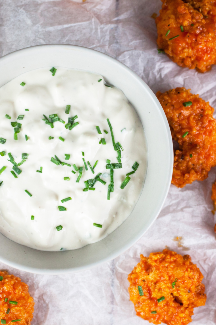 Creamy homemade Popeyes buttermilk ranch dressing in white bowl