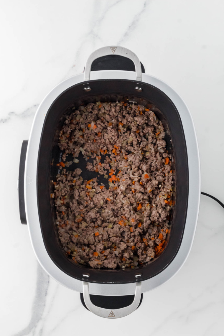 Brown ground beef and pork until deeply cooked and flavorful