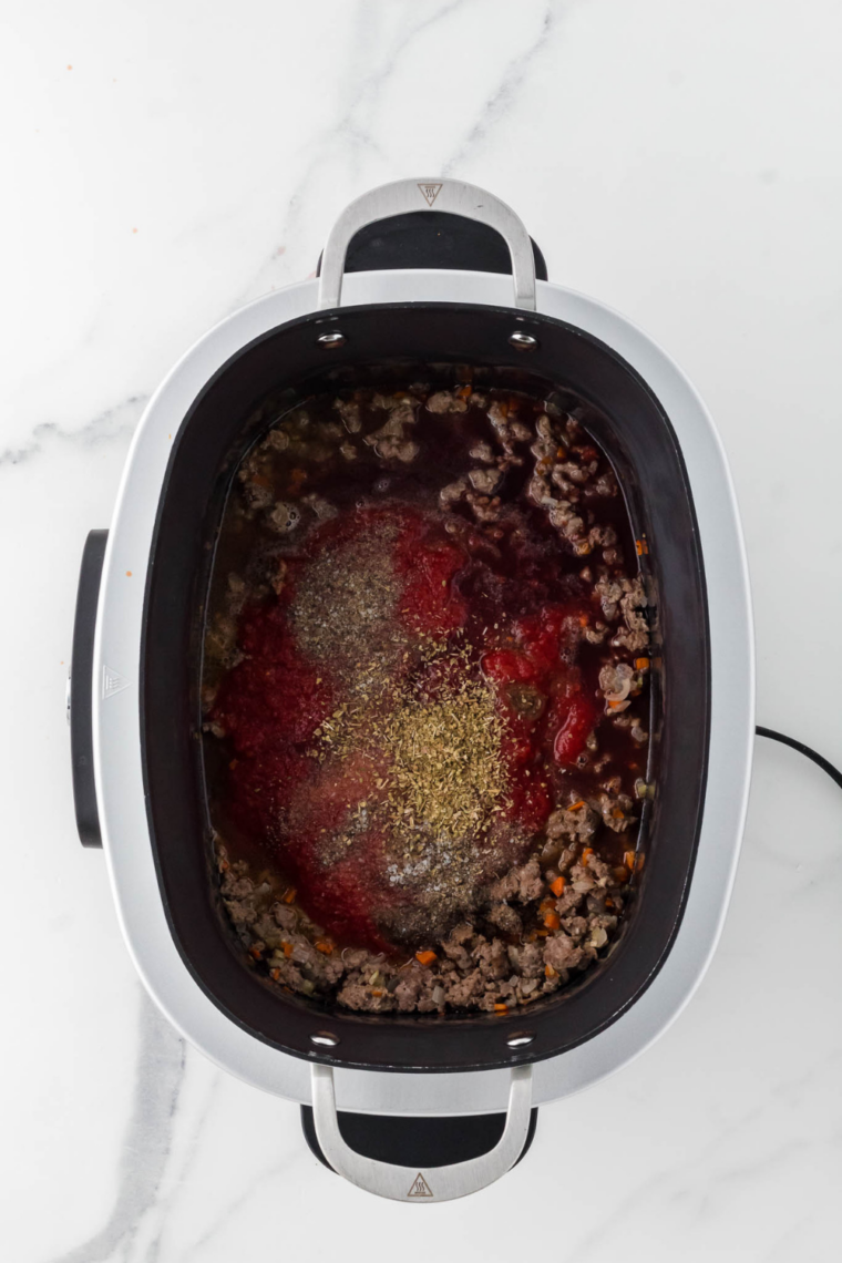 Combine crushed tomatoes tomato paste broth herbs and seasonings slow cooker