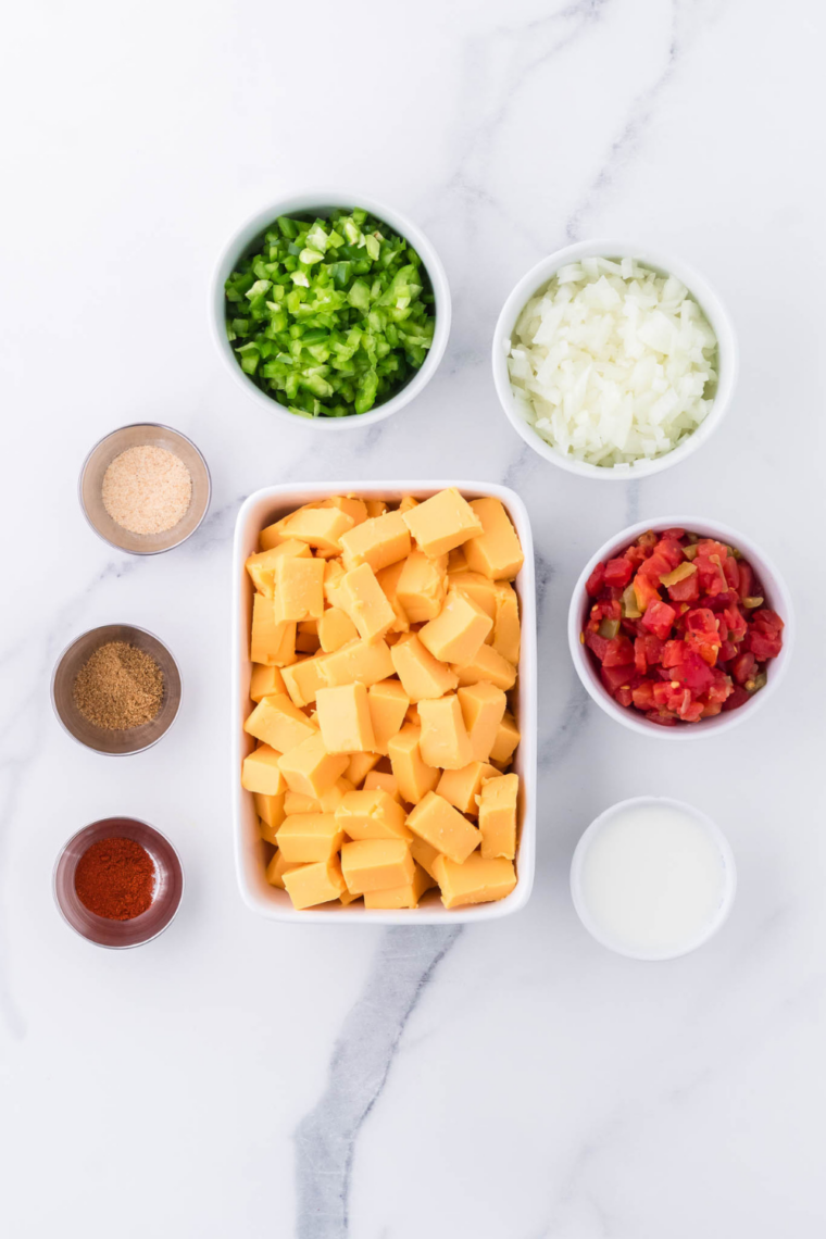 Ingredients needed for Slow Cooker Queso with Velveeta on kitchen table.