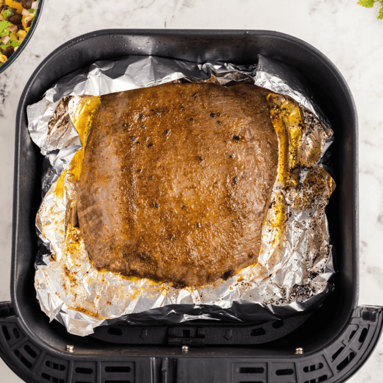 Steak pieces marinating in a sticky, golden Honey Garlic Marinade showing the glossy texture of the glaze