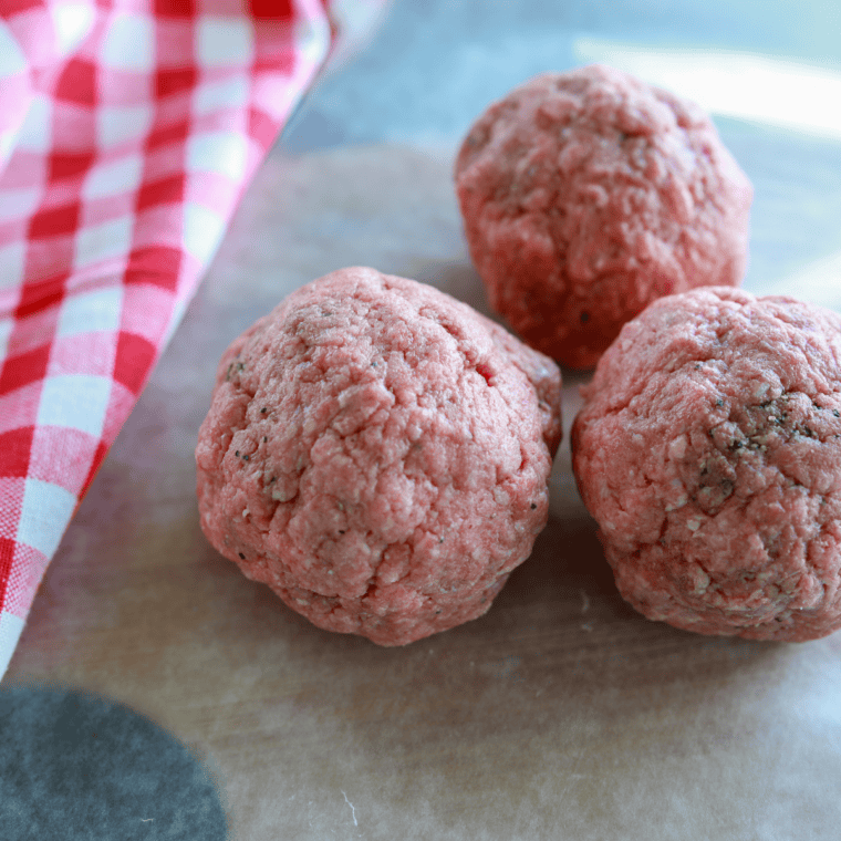 Ground beef rolled into 2-ounce balls for air fryer smashburger sliders