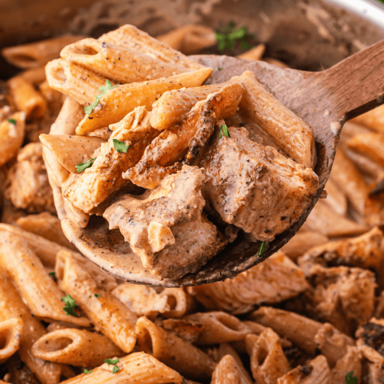 Creamy salmon pasta with flaky salmon pieces tossed in a rich garlic cream sauce