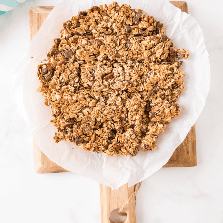 Air fryer peanut butter granola in clusters on a white plate