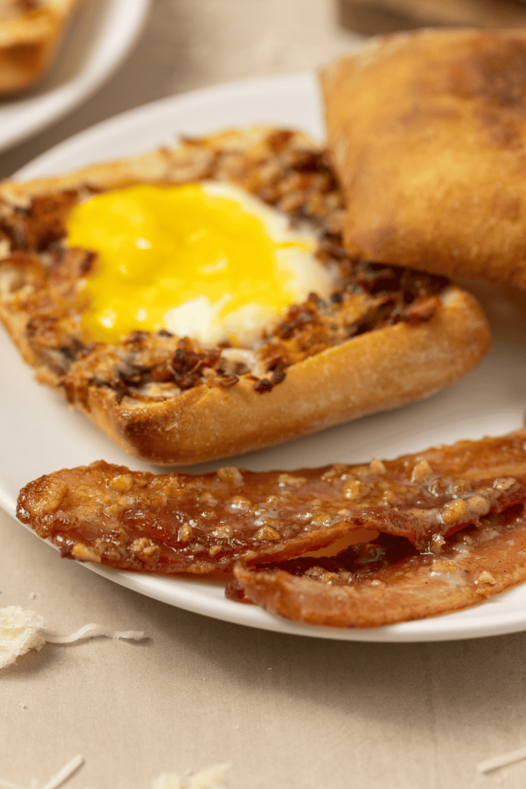 Close-up of crispy air fryer praline bacon showing the candied pecan glaze
