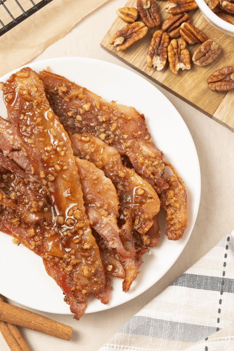 Close-up of crispy air fryer praline bacon showing the candied pecan glaze