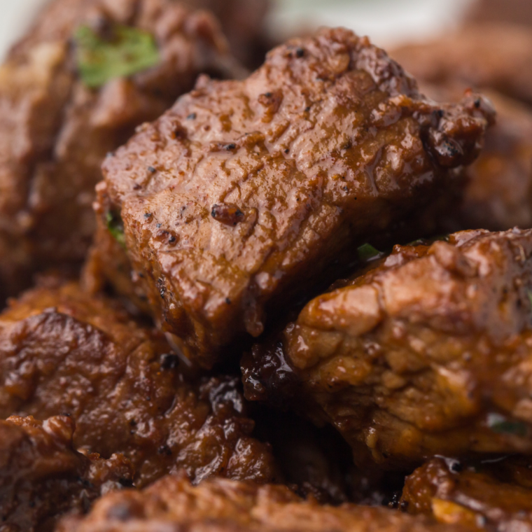 Close-up of crispy seared steak bites on a Blackstone flat top grill