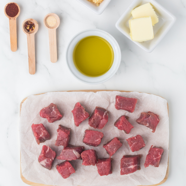 Ingredients needed for Blackstone Steak Bites on kitchen table.