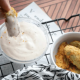 Burger King ranch sauce copycat in a small dipping cup next to crispy fries