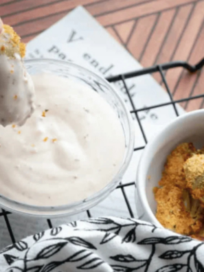 Burger King ranch sauce copycat in a small dipping cup next to crispy fries