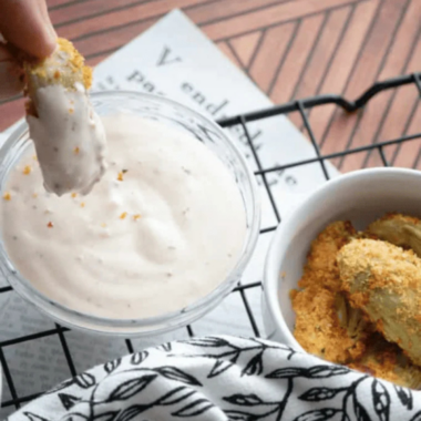 Burger King ranch sauce copycat in a small dipping cup next to crispy fries