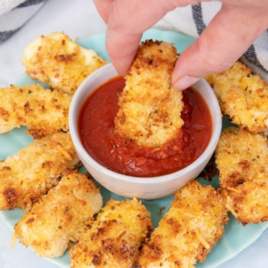Burger King marinara sauce in a small dipping cup served with crispy mozzarella sticks