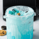 Scoops of pastel blue copycat Cold Stone cotton candy ice cream in a bowl, made in the Ninja Creami