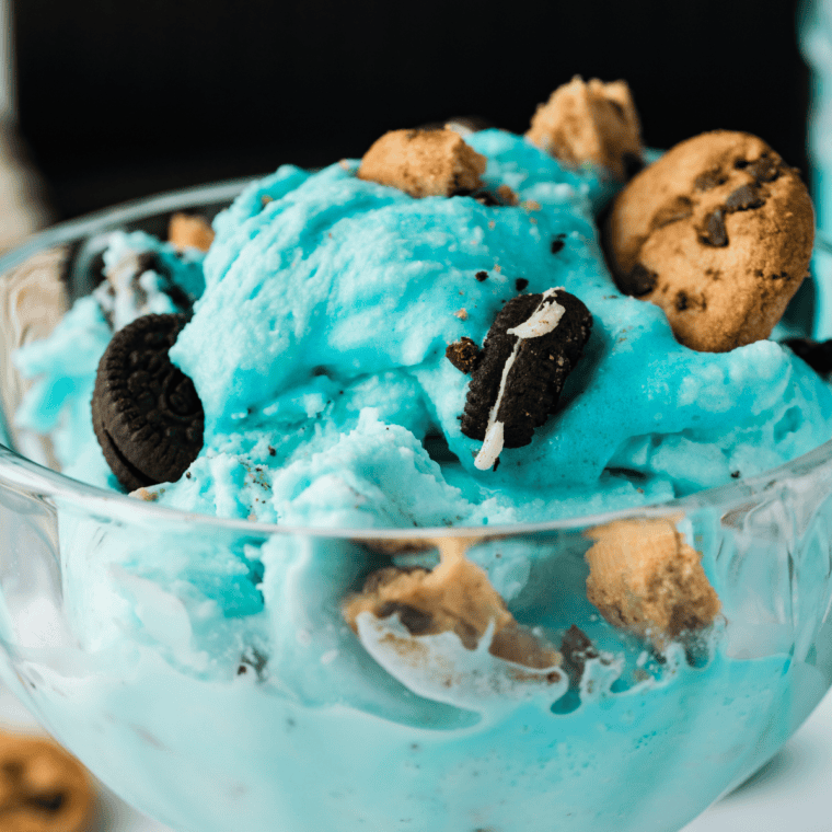 Scooping finished copycat Cold Stone cotton candy ice cream into a bowl