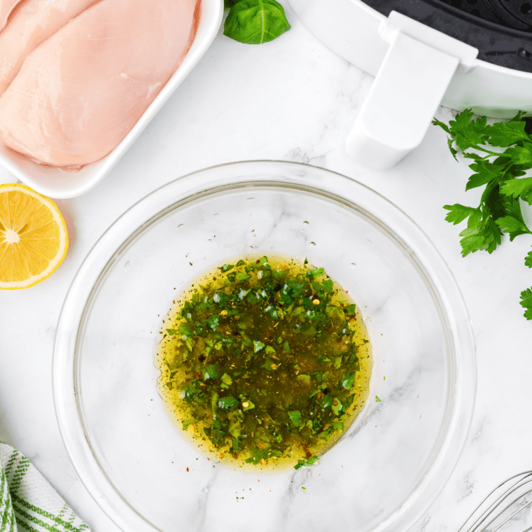Add the seasonings: Black pepper, dill seed, rosemary, and lemon zest stirred into homemade lemon pepper marinade