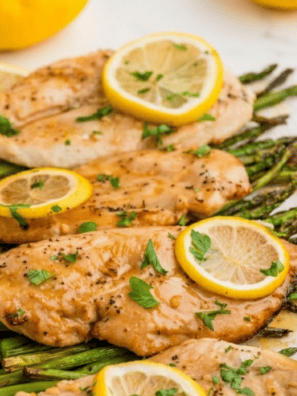 Copycat McCormick lemon pepper seasoning on grilled chicken breast with roasted asparagus on a white plate