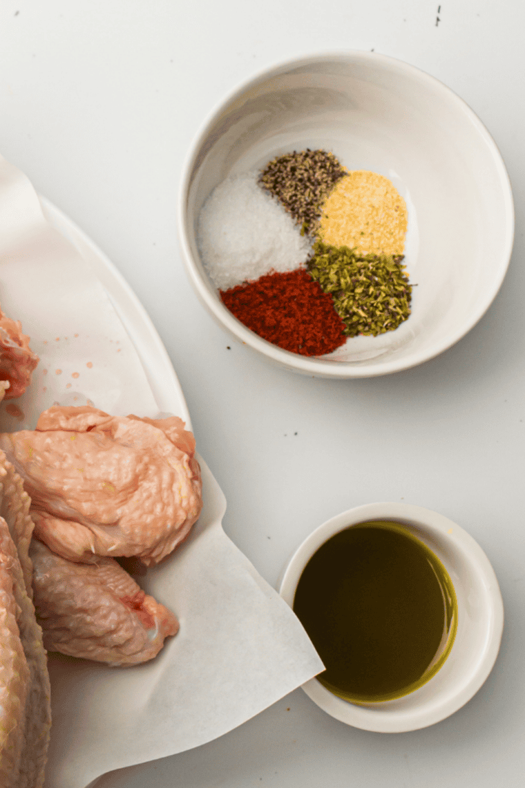 Copycat Mrs. Dash salt-free seasoning in a glass spice jar with a wooden spoon