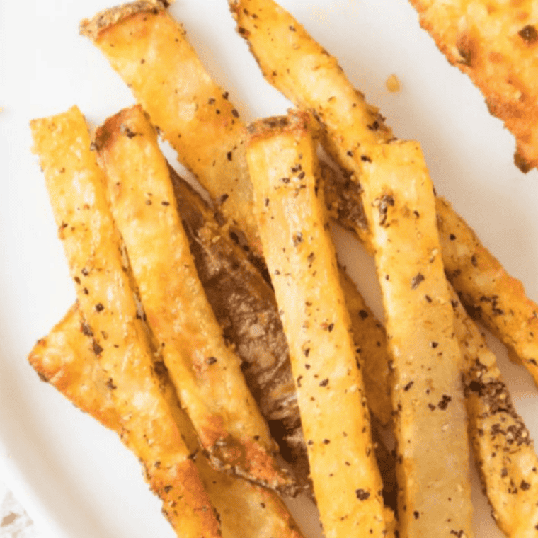 Crispy fries seasoned with homemade salt-free spice blend and a side of dip