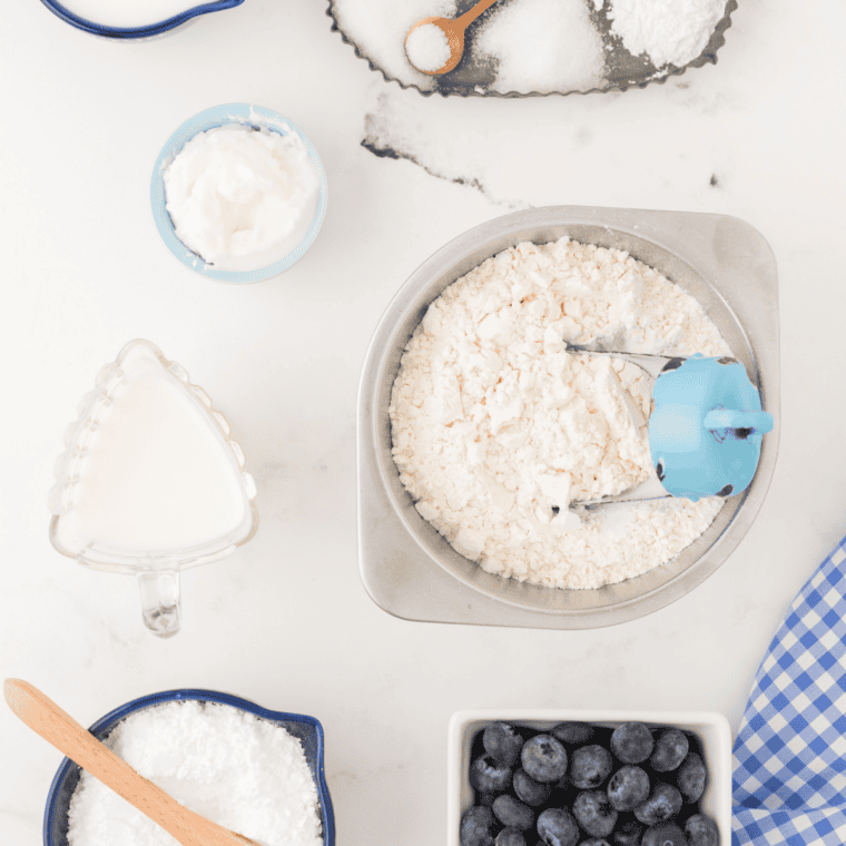 whisking flour, sugar, baking powder, and salt in large mixing bowl for scones
