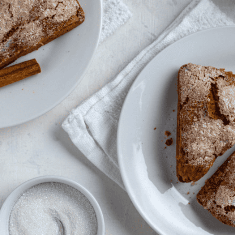 Copycat Starbucks Maple Oat Nut Scones drizzled with maple glaze on parchment paper