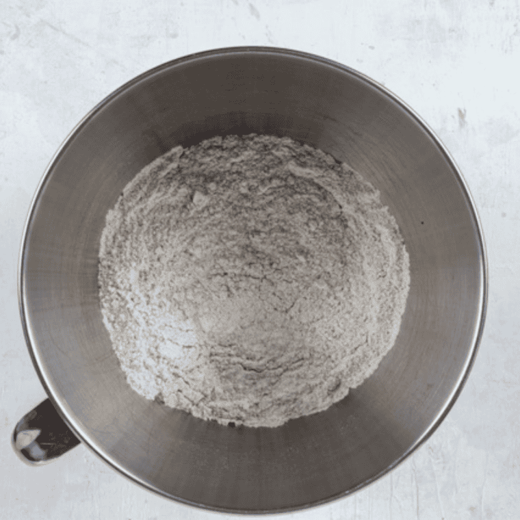 Dry ingredients whisked together in a bowl for maple oat nut scones