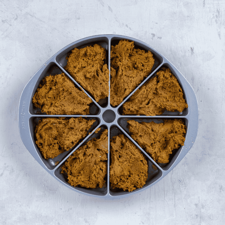 Maple oat nut scone dough patted into a circle and cut into wedges