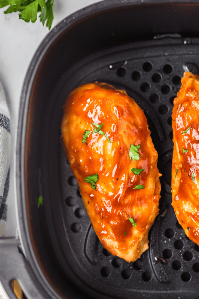Homemade Stubb's Original barbecue sauce spooned on top of a cooked chicken breast