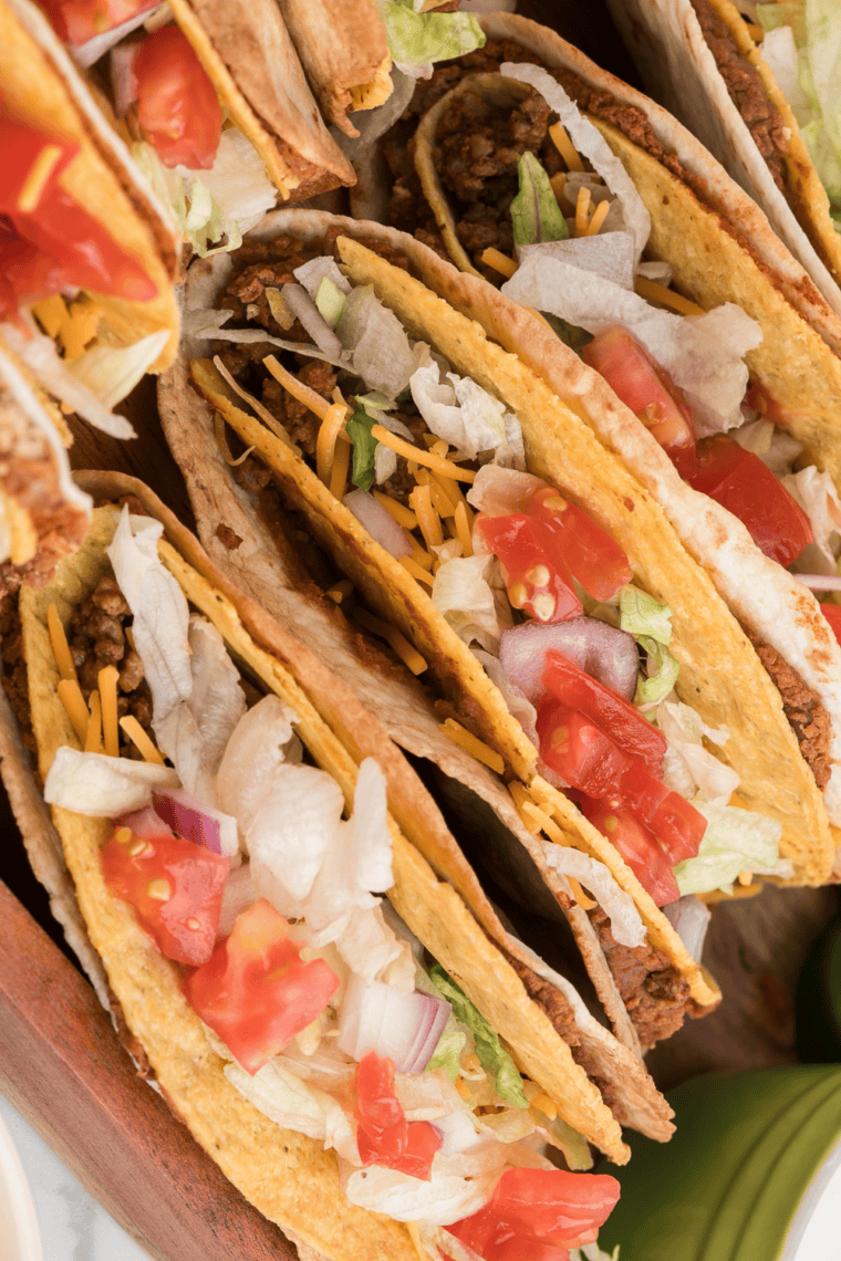 Overhead view of Del Taco copycat beef tacos served with rice and beans