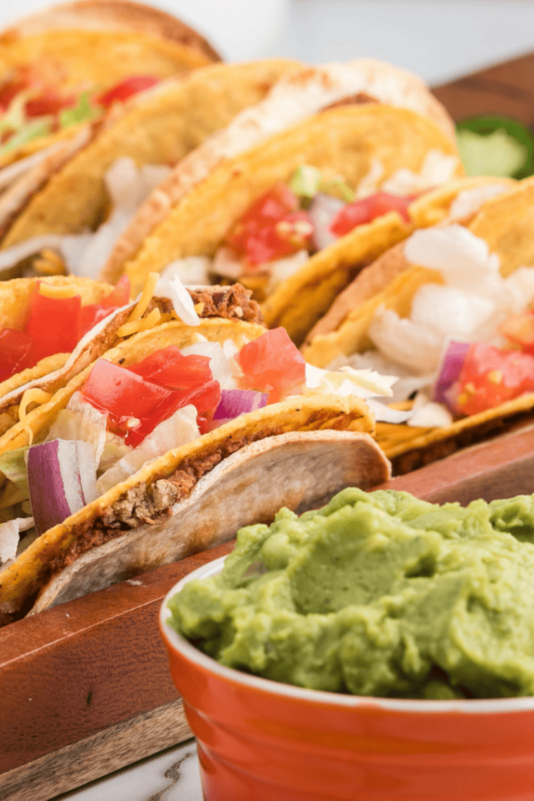 A plate of Del Taco copycat beef tacos with seasoned ground beef and crunchy shells