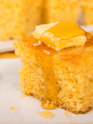 Square of moist Jason's Deli sweet cornbread topped with melting butter