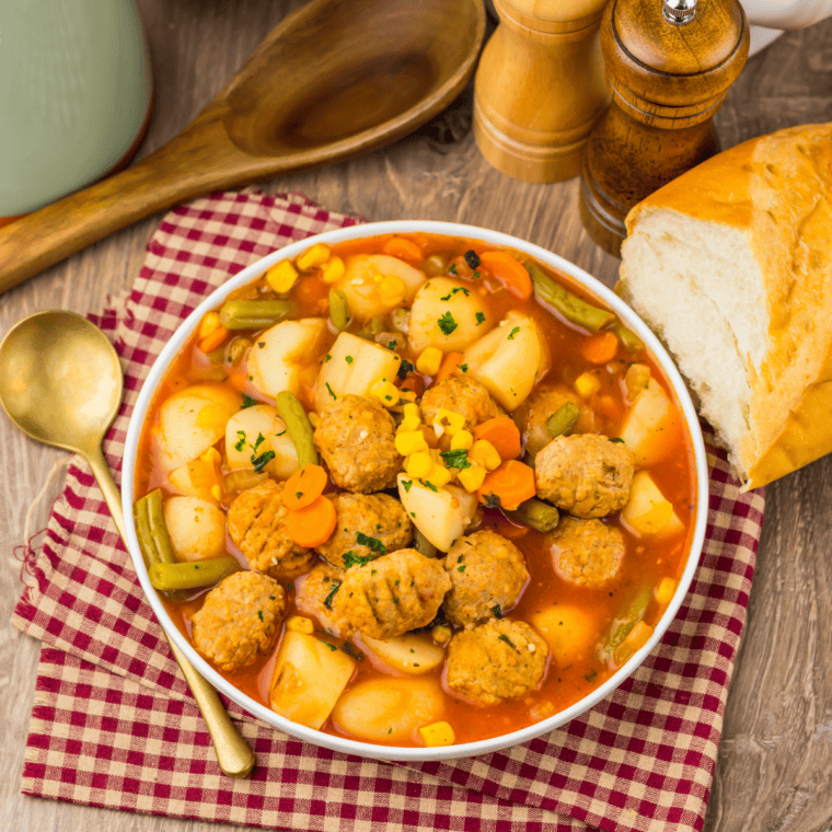 Finished meatball vegetable soup in the slow cooker after cooking, ready to serve