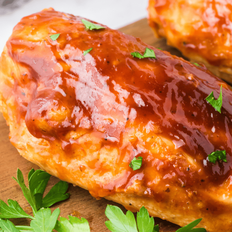 Jack Daniel's chicken breast glazed in sticky whiskey sauce, served over white rice with a sprinkle of green onions