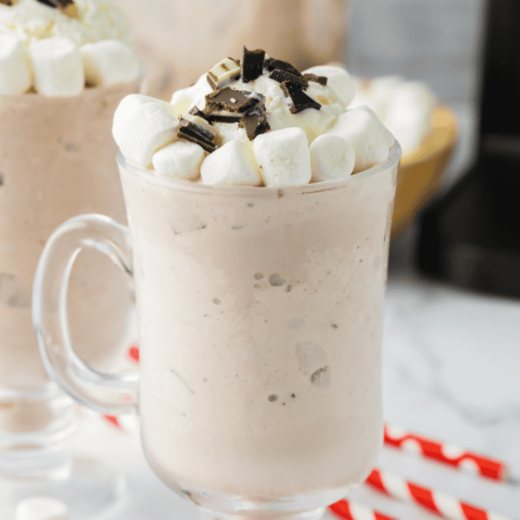 Jack Daniel's hot chocolate in a mug topped with whipped cream and chocolate shavings