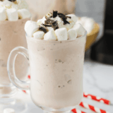 Jack Daniel's hot chocolate in a mug topped with whipped cream and chocolate shavings