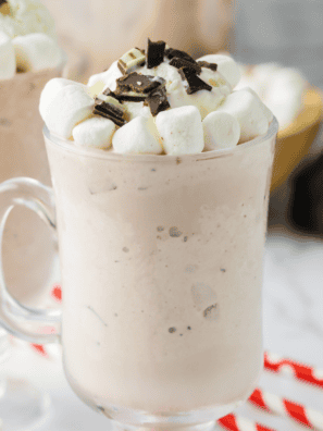 Jack Daniel's hot chocolate in a mug topped with whipped cream and chocolate shavings