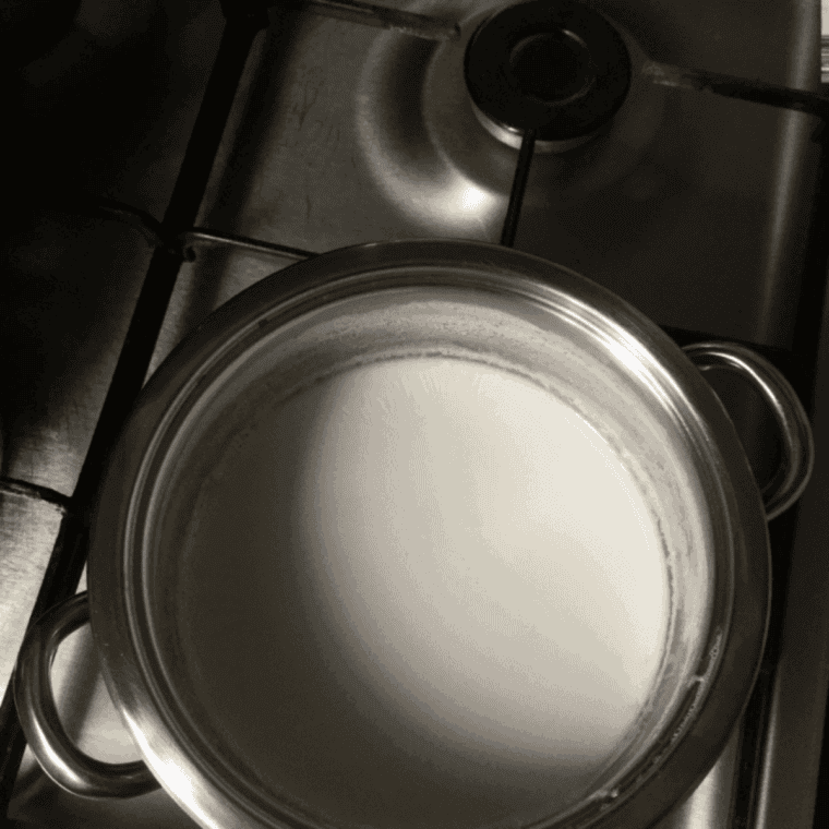 Heating milk and cream in a small saucepan for Jack Daniel's hot chocolate