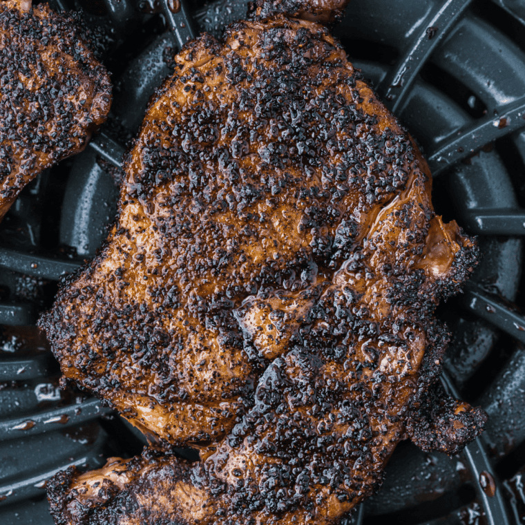 Instant-read thermometer checking the internal temperature of a rib eye steak