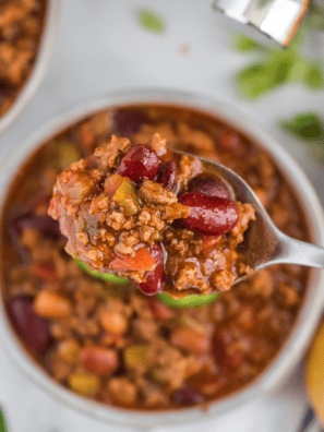 mccormick chili recipe in bowl with cheddar and sour cream