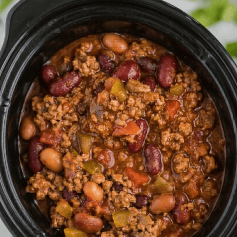 mccormick chili recipe crockpot version simmering with ground beef and kidney beans
