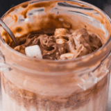 Ninja Creami copycat Blue Bell Rocky Road ice cream in a pint with marshmallows and almonds