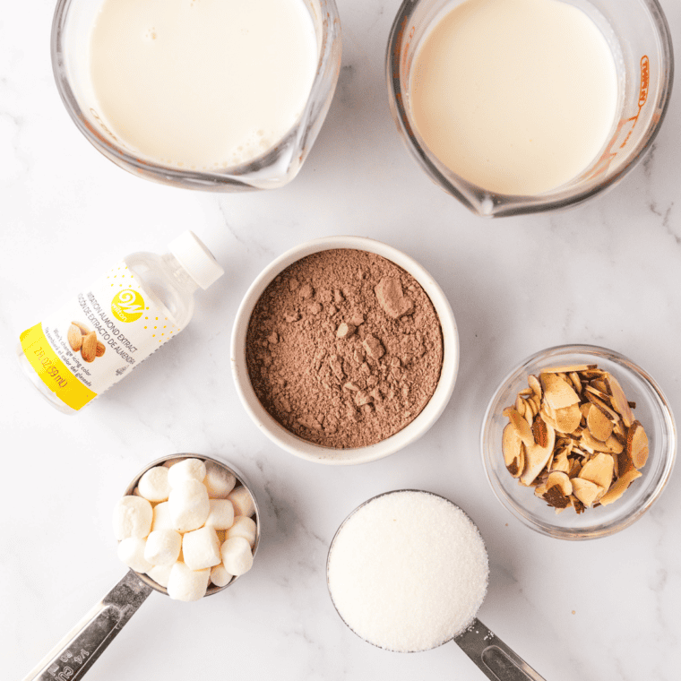 Ingredients for Ninja Creami copycat Blue Bell Rocky Road: milk, cream, sugar, Dutch cocoa, pudding mix, marshmallows, and almonds