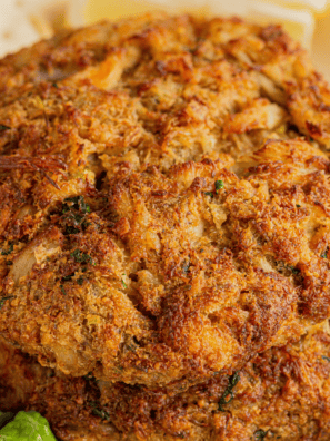 "Golden pan-seared jumbo lump crab cakes drizzled with lemon-garlic butter"